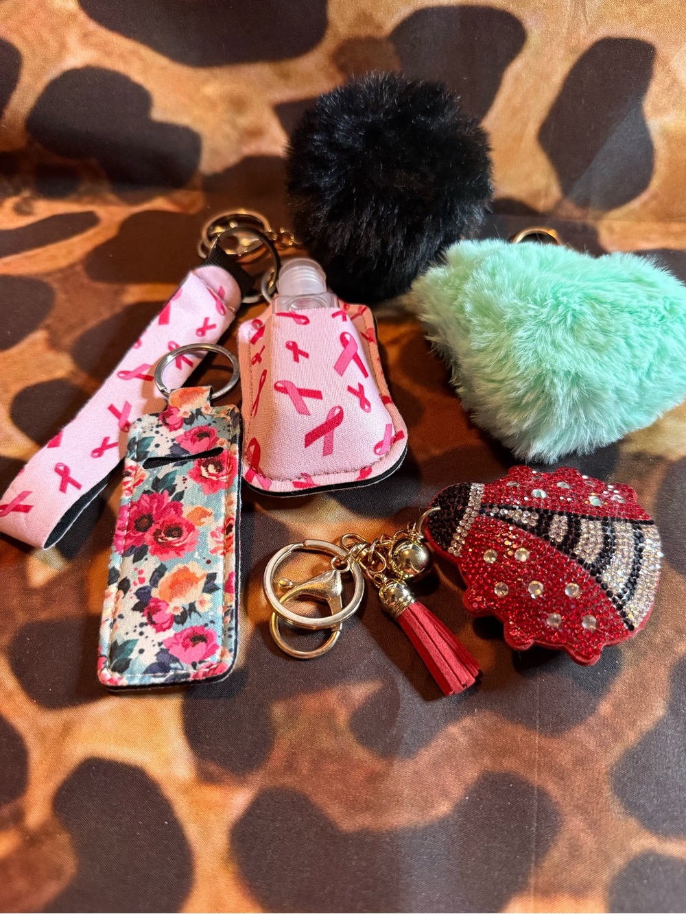 Assorted Keychain Set with Pink Ribbon Hand Sanitizer Holder & Floral Fob- 5